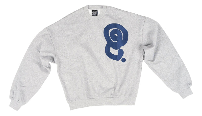 A light heather gray crewneck sweatshirt featuring a large navy blue abstract spiral graphic printed on the center chest, displayed flat against a white background.